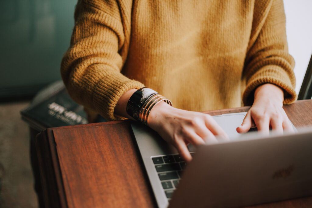 girl typing on a computer